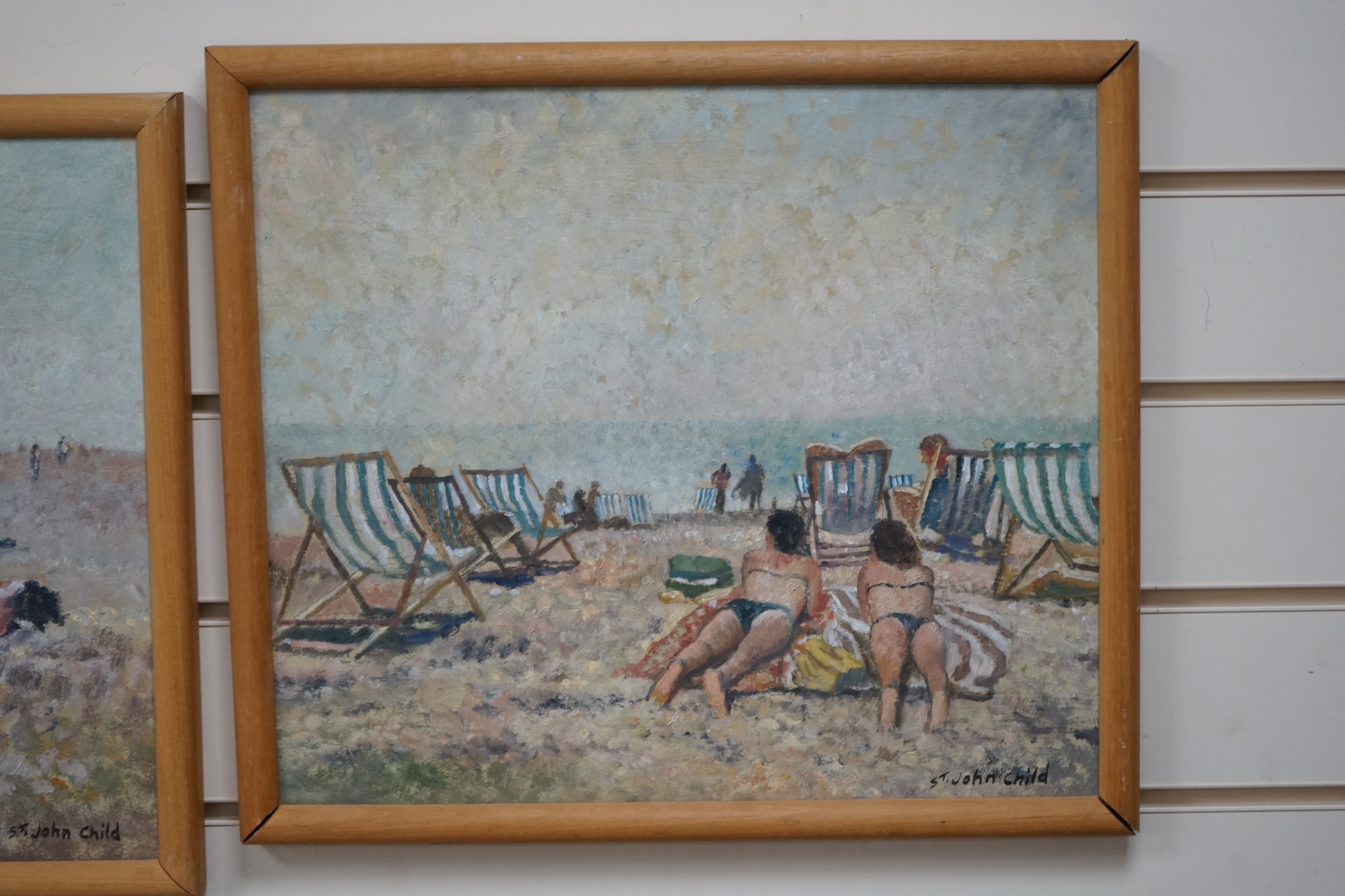 St John Child (b.1936), pair of oils on board, Beach scenes with figures, each signed, 34 x 42cm. Condition - good